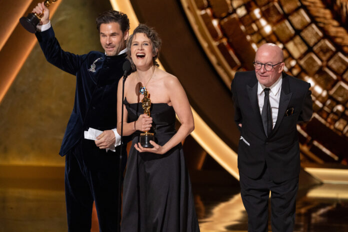 Clément Ducol, Jacques Audiard and Camille Dalmais accept the Oscar® for Original Song during the live ABC Telecast of the 97th Oscars® at the Dolby® Theatre at Ovation Hollywood on Sunday, March 2, 2025.